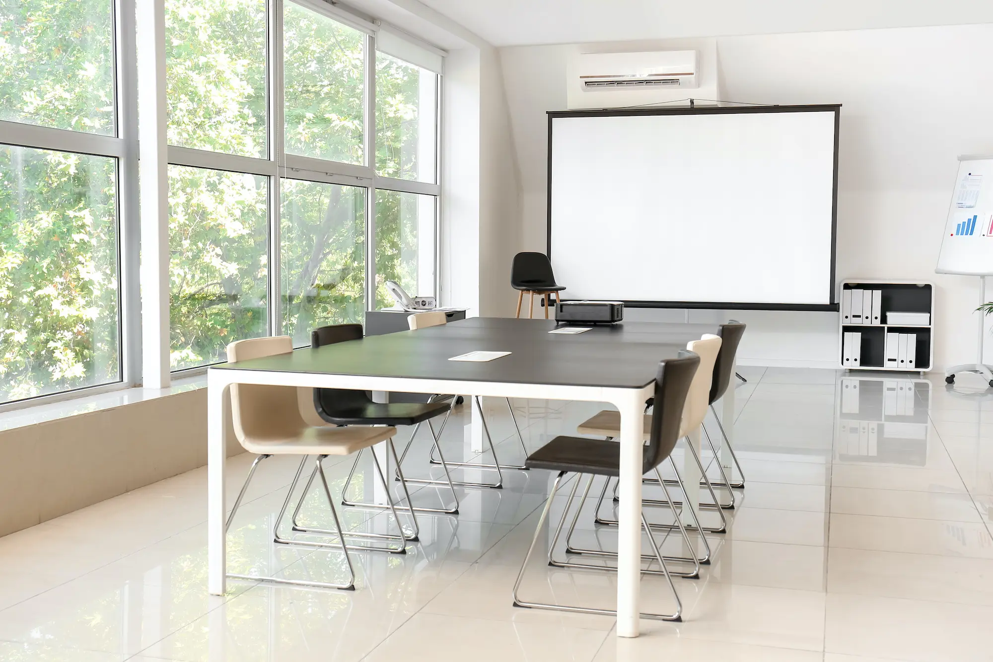 Room with projector prepared for conference in office